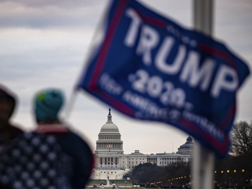 caption: The U.S. Capitol is seen across the National Mall as supporters of President Donald Trump begin to gather for a rally on January 6, 2021. Some of those supporters later attacked the Capitol. New records show a seven-hour gap in Trump's phone call record around the time of the siege.