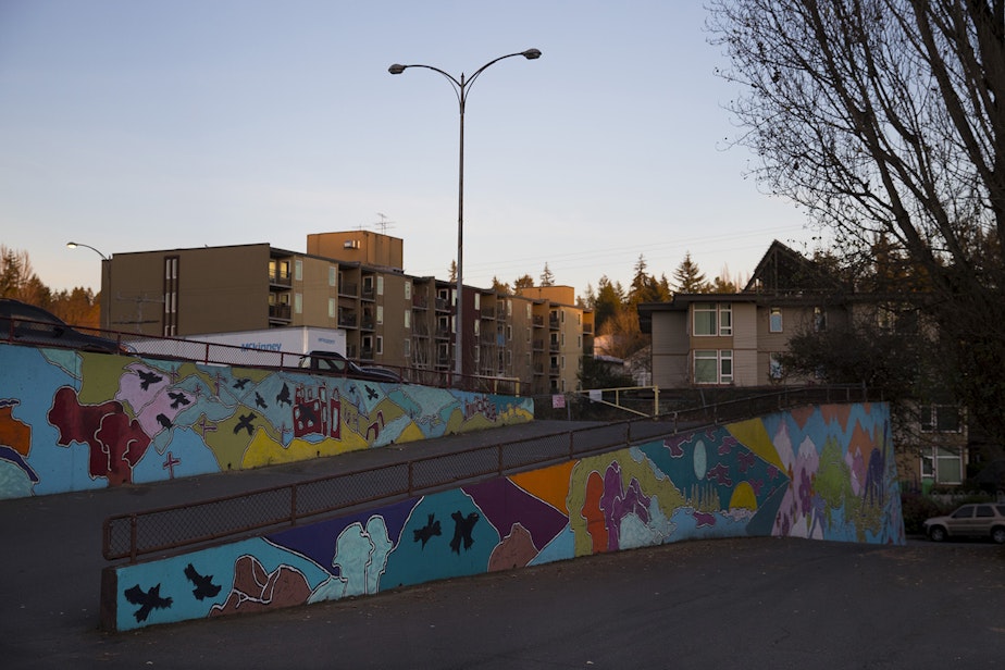 caption: Murals are on display behind the Value Village store on Thursday, December 6, 2018, along Lake City Way Northeast in Seattle.