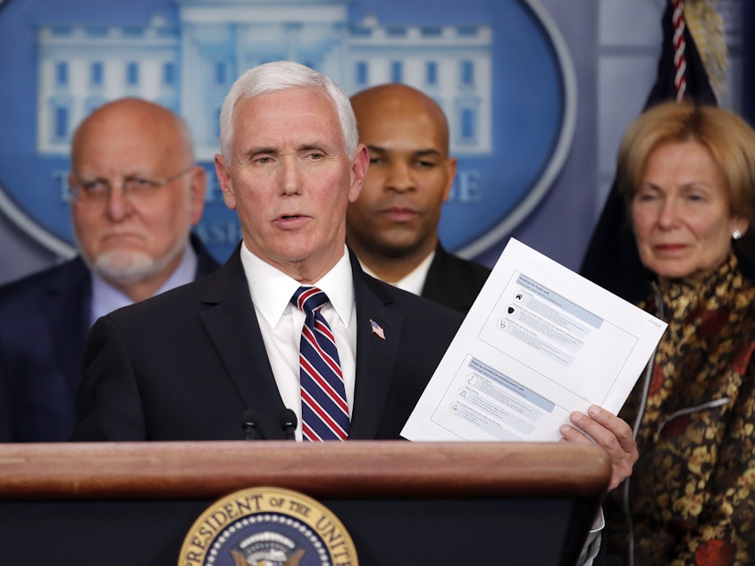 caption: Vice President Pence speaks in the briefing room of the White House on March 9 about the coronavirus outbreak.